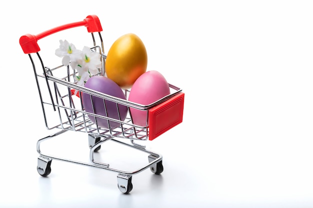 Colorful easter  eggs in shopping cart isolated Easter concept. Close up.