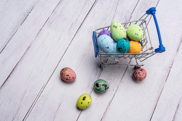 Colorful Easter eggs in a supermarket cart Easter greeting card