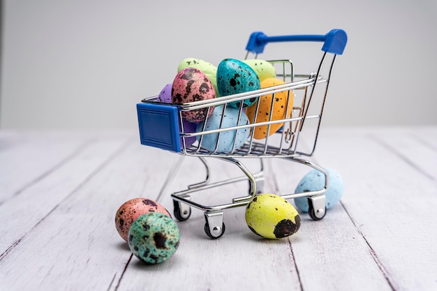 Colorful Easter eggs in a supermarket cart Easter greeting card