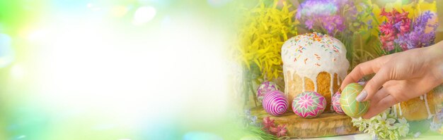 Colorful Easter eggs on the table and blue sky empty background with copy space