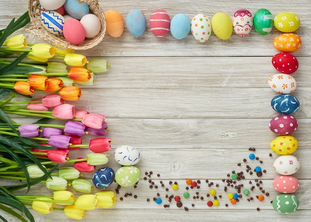 colorful easter eggs and tulips