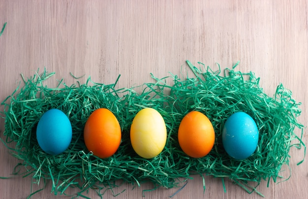 Colorful easter eggs on the white wooden. Happy easter concept.