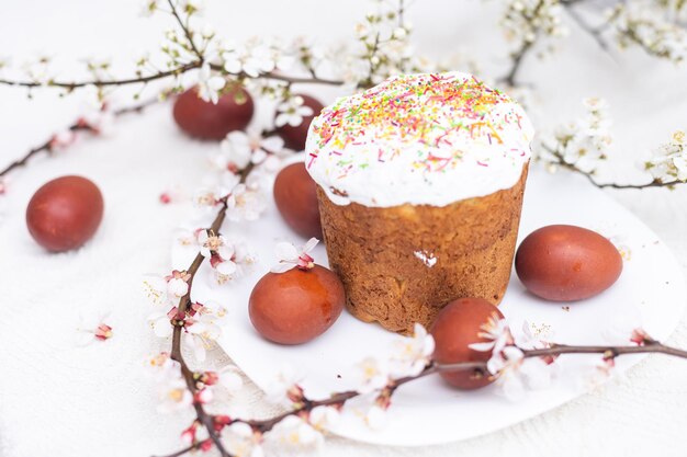 Colorful Easter eggs with spring blossom flowers. Colored Egg Holiday border. Easter cake.