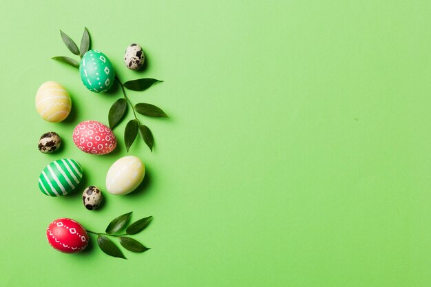 Colorful easter eggs with spring flower leaf isolated over white background colored egg holiday border