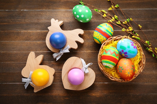 Colorful Easter eggs on wooden background