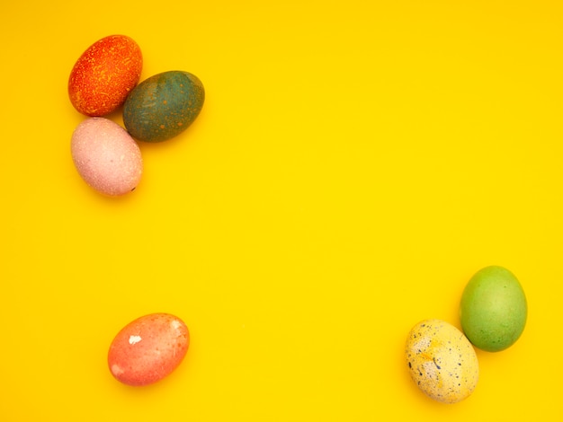 Colorful Easter Eggs On Yellow Background