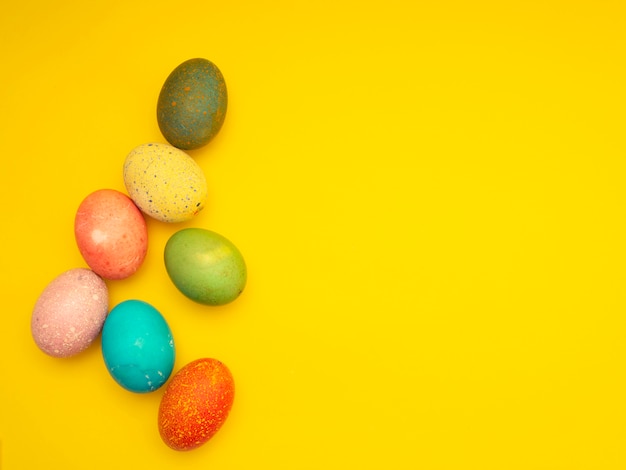 Colorful Easter Eggs On Yellow Background