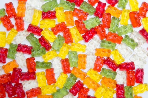 Colorful eat gummy bears jelly candy background