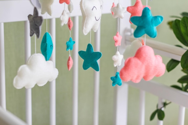 Photo colorful and ecofriendly children's mobile from felt for children handmade