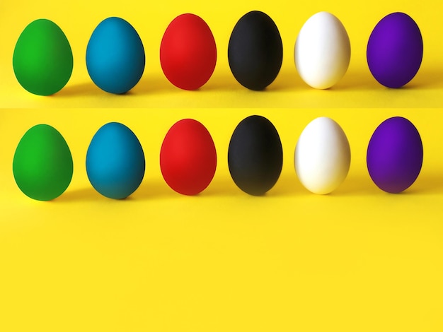 Colorful eggs on the yellow background