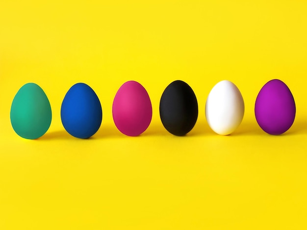 Colorful eggs on the yellow background