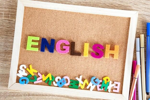 Colorful ENGLISH word alphabet on a pin board background