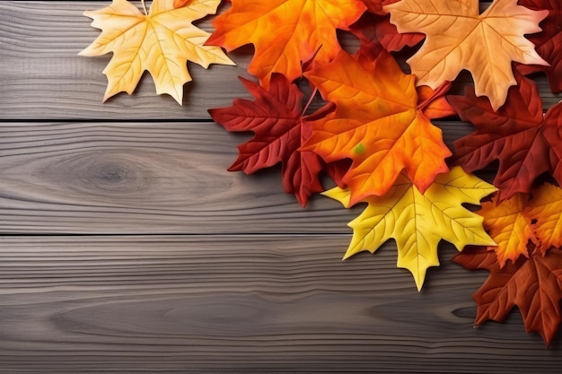 colorful fall leaves laid down on a wooden background