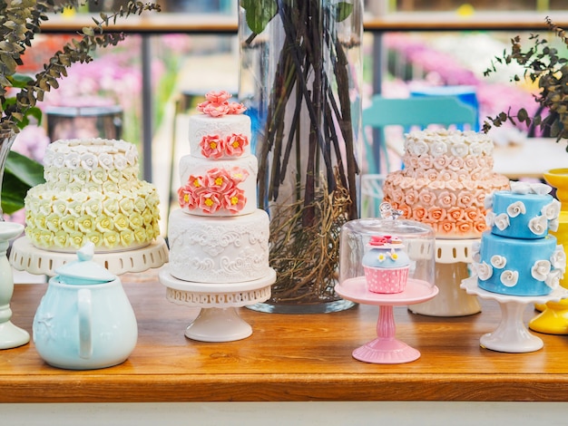 Colorful fancy cake on white cakestand 