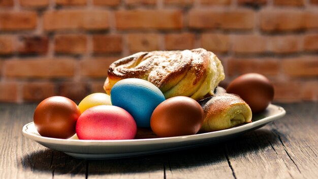 Colorful festive easter eggs and easter sweet baking