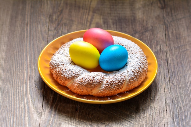 Colorful festive easter eggs and easter sweet baking