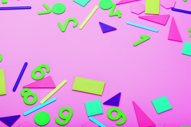 Colorful figures and numbers for children on a pink background. A tool for developing children's thinking.