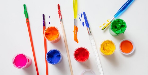 Colorful finger paints set on white color background top view