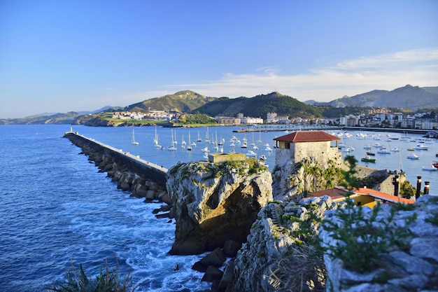 Colorful fishing boats anchored near the port The Way of St James Northern Route Spain