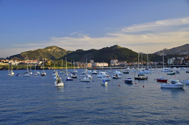 Colorful fishing boats anchored near the port The Way of St James Northern Route Spain