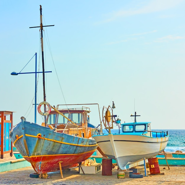 Colorful fishing boats on dry boat parking in Ayia Napa, Cyprus