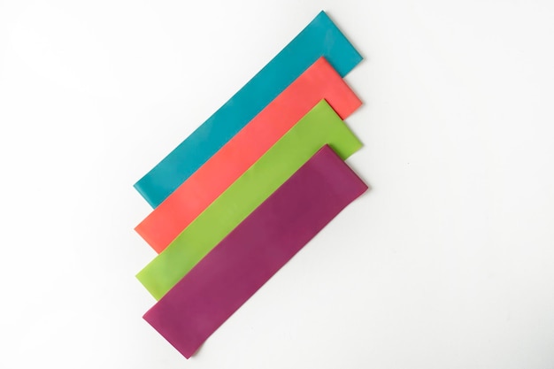 Colorful fitness bands lying on a white background