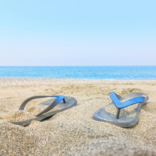 Colorful Flip Flops on the Sandy Beach Caribbean Sea