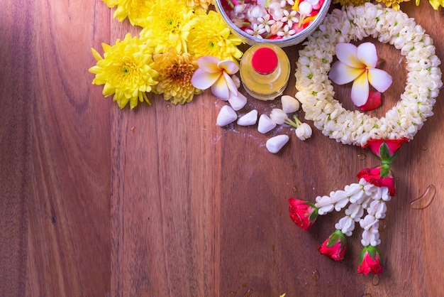 Colorful flower in water bowl and pipe gun 