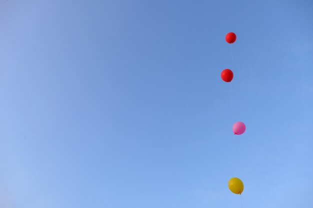 Colorful flying balloon with blue sky. Freedom concept.