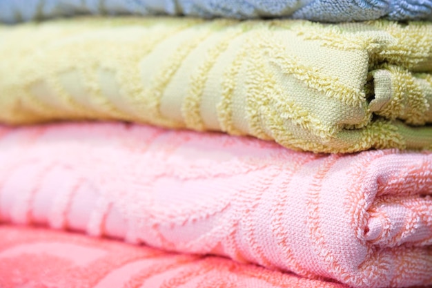 Colorful folded towels stack closeup picture hotel service concept