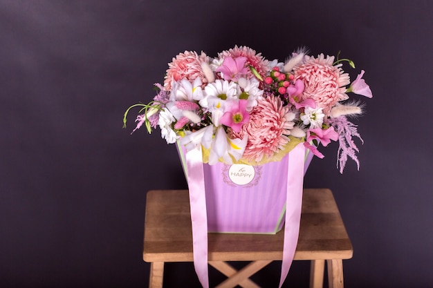 Colorful fresh bouquet of flowers on isolated black background