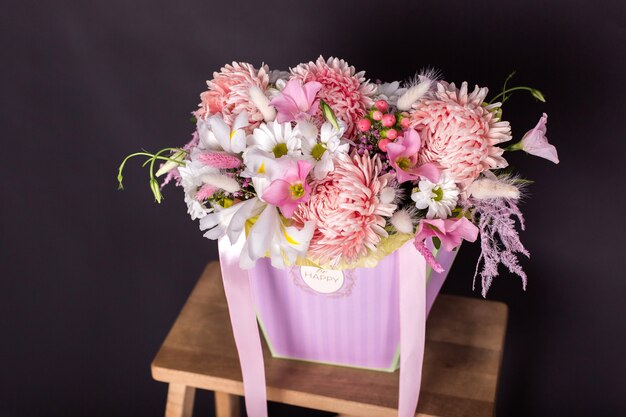 Colorful fresh bouquet of flowers on isolated black background