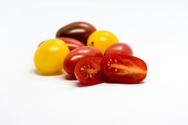 Colorful of fresh red and yellow cherry tomatoes in the foreground