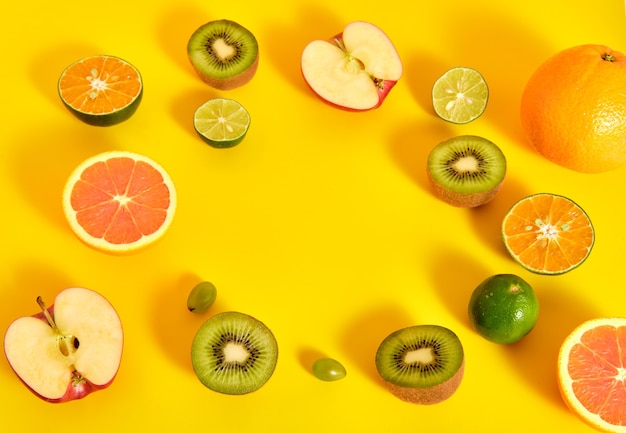 Colorful fruits on a yellow