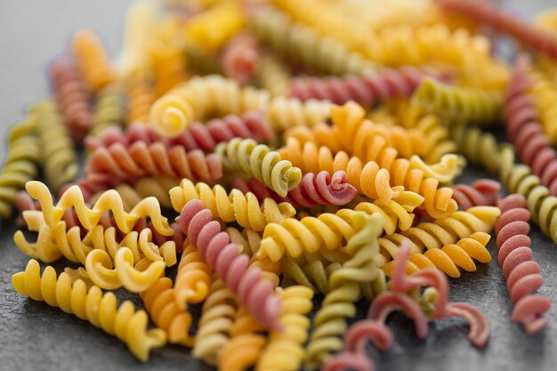 Colorful fusilli pasta Multicolor spiral macaroni Closeup