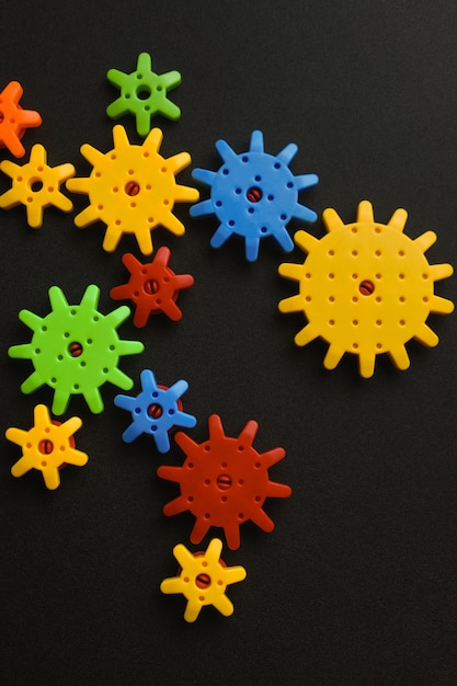 Colorful gears on black background