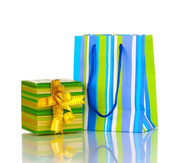 Colorful gift bags with gifts isolated on white