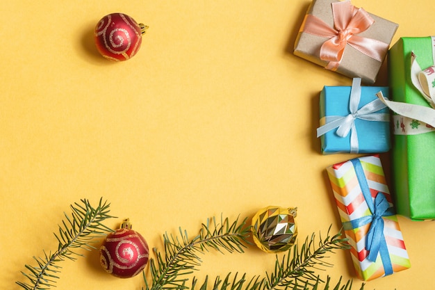 Colorful gift boxes toy yellow background.