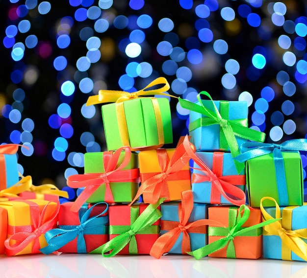 Colorful gifts close-up on a bokeh background