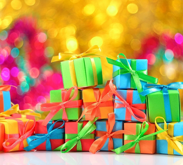 Colorful gifts close-up on a bokeh background