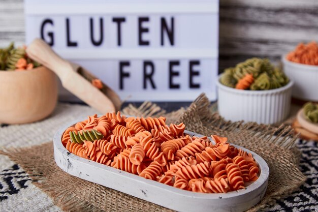 Colorful green pea and carrot pasta fusilli with whole grain wheats with no gluten Organic healthy food for people with lactose intolerance