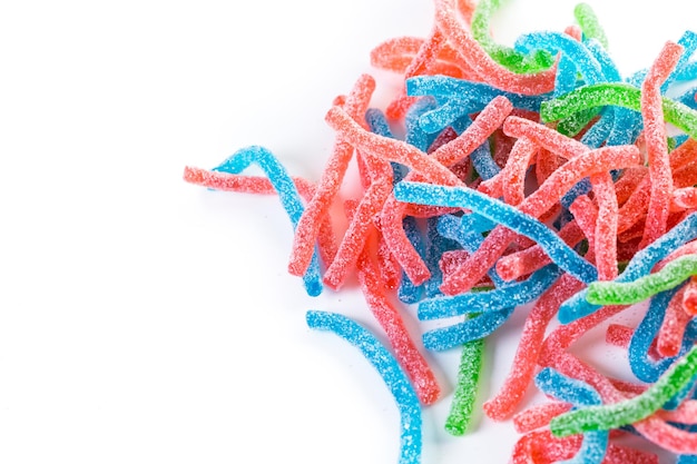 Colorful gummi candies on a white background.