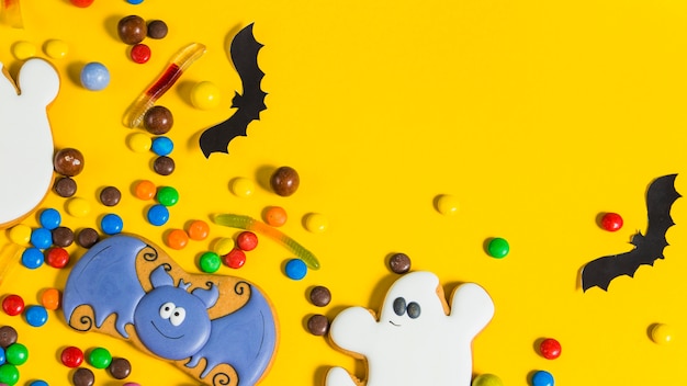 Colorful halloween candies and paper bats