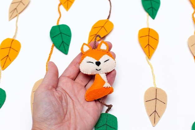 Colorful handmade felt toys collection for playful little kid Concept of early childhood development soft and child safe playthings for small children colorful stars and sleeping cute fox