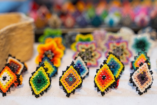 Colorful handmade huichol rings at market in Guadalajara, Mexico. Traditional Mexican handcraft