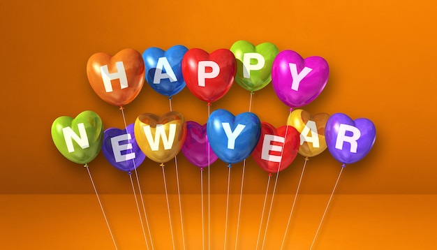 オレンジ色のコンクリートの背景にカラフルな新年あけましておめでとうございますハート形の風船。横長のバナー。 3Dイラストレンダリング