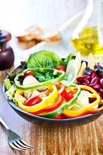 Colorful Healthy salad by pepper and olive oil