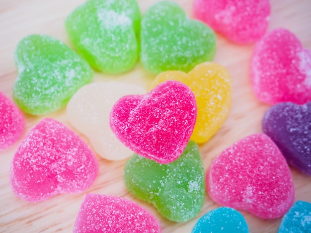 Colorful hearts candy on wood for valentines background