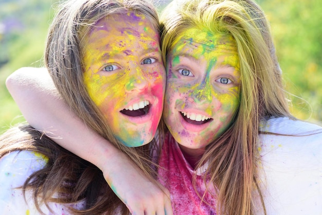 Colorful holi on painted face drycolors colorful neon paint
makeup children with creative body art crazy hipster girls summer
weather happy youth party optimist spring vibes friendship