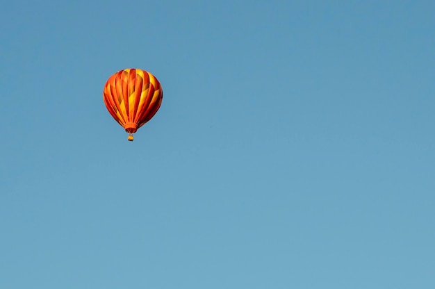 Colorful hot air balloon against blue sky